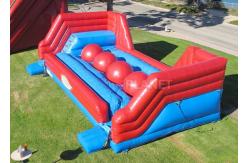 China Red Balls Inflatable Sports Games Wipe Out Interactive Obstacle Course supplier