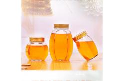 China Metal Lid Glass Honey Jar Hexagon Shape Recyclable Food Storage Container supplier