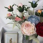 Decorative flowers with artificial rose ornaments
