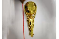 China Shiny Gold Plated Custom Trophy Cup With The Statue Holding The Ball Design supplier
