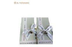 China Cardboard Paper Foldable Card Box Folder Lip Packaging Box With Ribbon Bow supplier