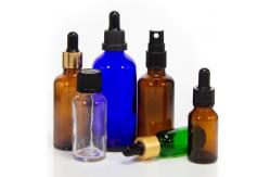 China Customized Hot Stamping 2oz Glass Dropper Bottles With Plastic Lid supplier