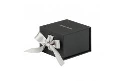 China Custom Logo UV Coating Cardboard Flip Ring Earring Packaging Box with Ribbon Design supplier
