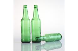 China Empty Amber Green Alcohol Glass Beer Bottles with Crown Caps supplier