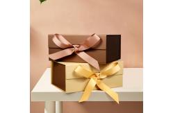 China Customized Elegant Magnetic Folding Cardboard Rigid Box Makeup Box With Ribbon supplier