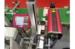 China Auto Online Flying CO2 Laser Marking Machine 30W Expiry Batch Code Laser Printer supplier
