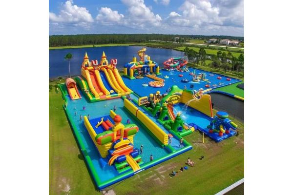 Land Inflatable Water Park With Big Slides And Floating Toys