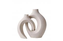 China Embrace Hollow Ceramic Vase for Modern Home Decor supplier