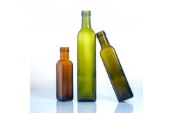 China In Stock 250Ml 500Ml 750Ml Round Glass Oil Bottles With Lid supplier