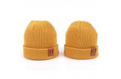 China Leather Patch Knit Beanie Hats Custom Design Warm Hat Cap Yellow Beanie Hats supplier