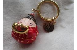 China Chinese Style Ceramic Fat Baby Gold Ingot Key Chain In Red Coat supplier