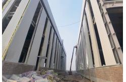 China Industrial Steel Frame Warehouse With H Beam And Sandwich Panel Roof Cladding supplier