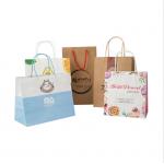 Color Printed Eco friendly kraft paper Carrying Shopping Bags with handles for sale