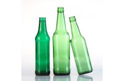 China Empty Amber Green Alcohol Glass Beer Bottles with Crown Caps supplier