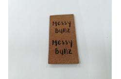 China Suede Microfiber PU Leather Label Washable With Embossed Logo supplier
