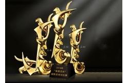 China Poly Resin Material Award Cups Trophies With Abstract Figure Design supplier