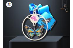China Shiny Silver Stock Dancing Butterfly Relief Medals Cut Out With Sublimated Ribbon supplier