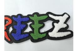 China Towel Heat melting Embroidered Sew On Labels Garment Washable Patches supplier
