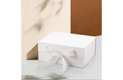 China Customized Elegant Magnetic Folding Cardboard Rigid Box Makeup Box With Ribbon supplier