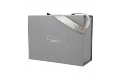 China Luxury Silver Folding Gift Box Custom Foil Stamping Logo With Ribbon Handle supplier