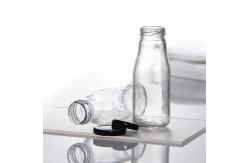 China Bpa Free 25Oz 32Oz Pasterurization Juice Milk Delivery Glass Bottle With Metal Lid supplier