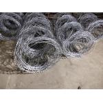 Hot Dipped Galvanized BTO-18 Concertina Coil Wire Flat Wrap Razor Barbed Wire for sale
