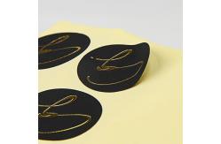 China Black Round Matte Black Paper Sticker Labels With Gold Logo supplier