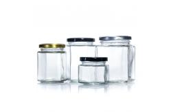 China Food Grade Empty Clear Hexagonal Square Glass Empty Food Storage Jars supplier