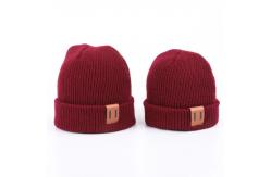 China Leather Patch Knit Beanie Hats Custom Design Warm Hat Cap Yellow Beanie Hats supplier