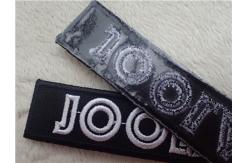 China Black Twill White Line Custom Embroidered Patches With Stylish Backing Hot Melt Adhesive supplier