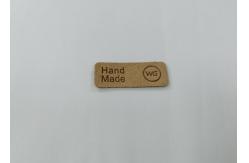 China Embossed Logo Microfiber PU Leather Patches Washable Labels Sew On Clothing supplier