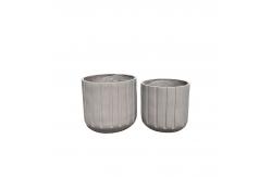 China Exquisite Hand Carved Fiber Clay Planter with Drainage Holes supplier