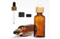 China Customized Hot Stamping 2oz Glass Dropper Bottles With Plastic Lid supplier