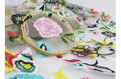 China Beautiful Polyester Flower Embroidered Net Lace Fabric 3d Flower Apparel Fabric supplier