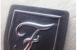 China Custom Heat Transfer Embossed Leather Patches 3D Logo On Suede , Clothes TPU Labels supplier
