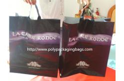China Black Soft Flexible Loop Handle Plastic Bags With Custom Printing supplier