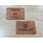 Embossed Logo PU Leather Patches Custom Color Sew On Clothing for sale
