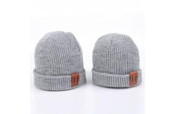 China Leather Patch Knit Beanie Hats Custom Design Warm Hat Cap Yellow Beanie Hats supplier