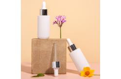 China Customized Hot Stamping 2oz Glass Dropper Bottles With Plastic Lid supplier