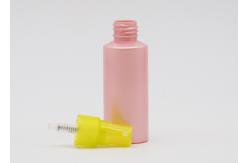China Flat Shoulder Pink PET 50ml Small Plastic Spray Bottles Refillable With Yellow Pump supplier