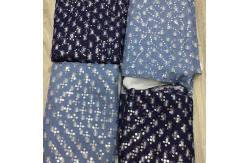 China Hollow Stretch Embroidered Sequin Jean Denim Fabric Polyester Cotton supplier