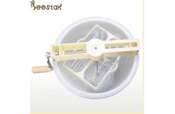 China 2 frame plastic manual honey processing extraction machine beekeeping honey extractor supplier