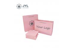 China Antibacterial Cosmetic Paper Bag With Ribbon Handle Dustproof Recyclable supplier