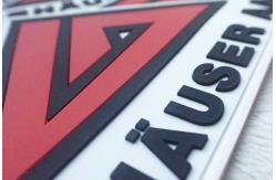 China Red And White Embossed Silicon Badges Customized Soft Rubber Logos PVC Patches supplier