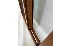 China UPVC Wood Foil Double Sliding Windows Custom European Style Energy Efficient supplier