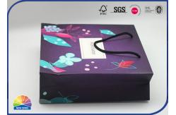 China 4C Printed Paper Packaging Special Bag Matte Lamination With Nylon Handle supplier