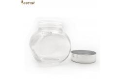 China 50ml Honey Jar And Spoon Flat Bottle With Metal Lid supplier