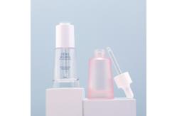 China 30ml Serum Oil Dropper Glass Bottle With Press Pump supplier