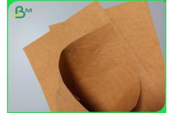 China Washable Good Flexibility 0.55mm Kraft Paper Fabric For Recyclable Wallet Making supplier