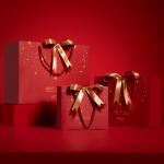 Customized Printed Red Christmas Paper Bags with Ribbon Bow for sale